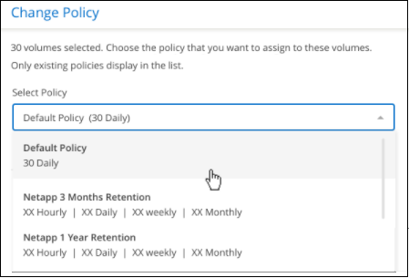 A screenshot showing how to select a new policy to apply to selected volumes.